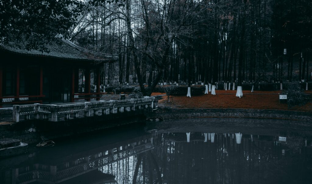 The emerald green Tsukioka Onsen open-air bath and the steam rising from the source